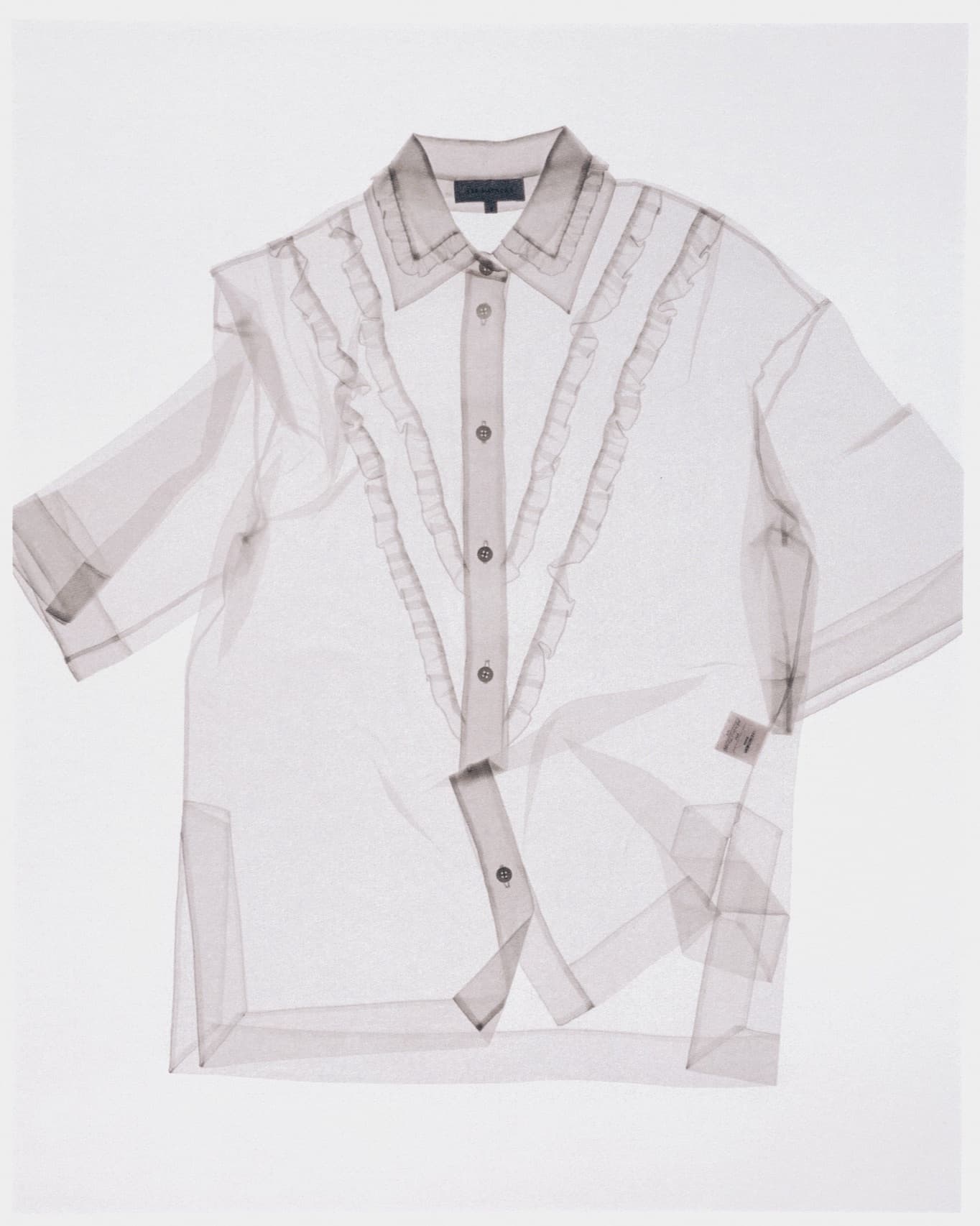 A sheer Lee Mathews shirt photographed on a plain background